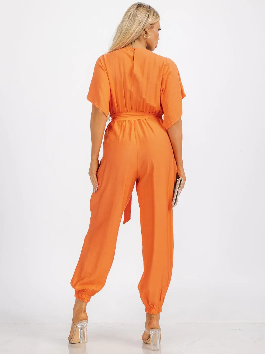 WOMEN'S SHORT SLEEVE SURPLICE FRINT POCKET SKINNY LEGS BELTED JUMPSUIT